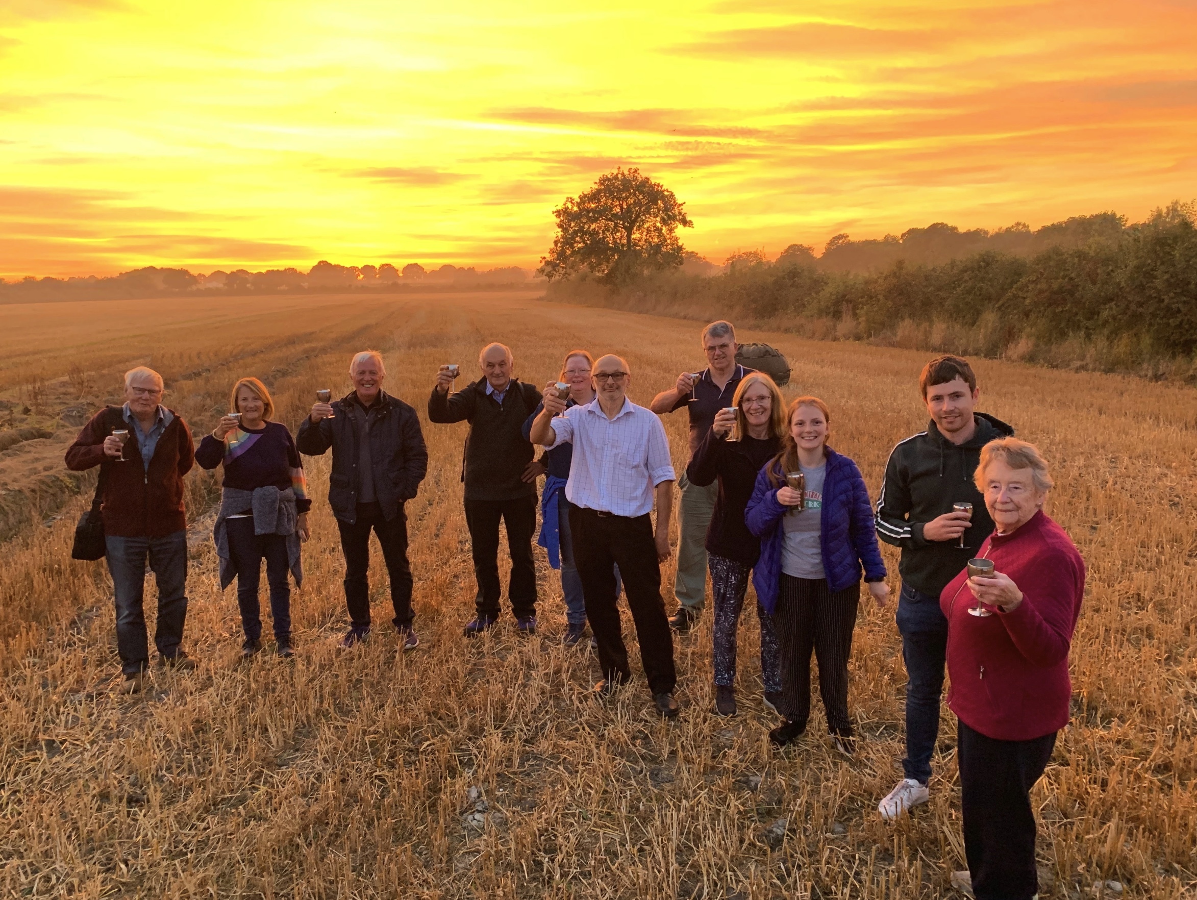 passengers enjoying a prosecco toast after a shrewsbury hot air balloon ride in shropshire