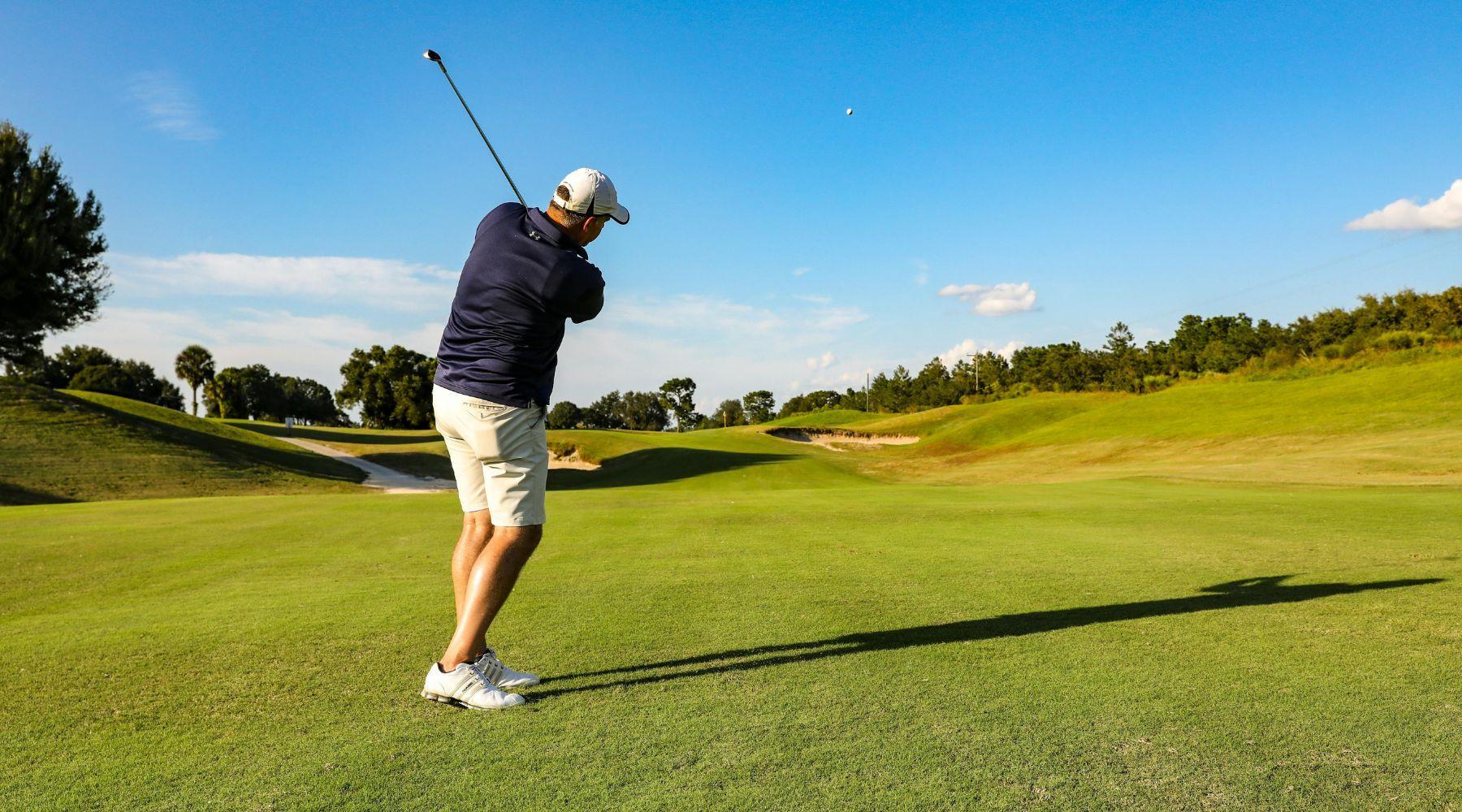 A man playing golf on a golf course