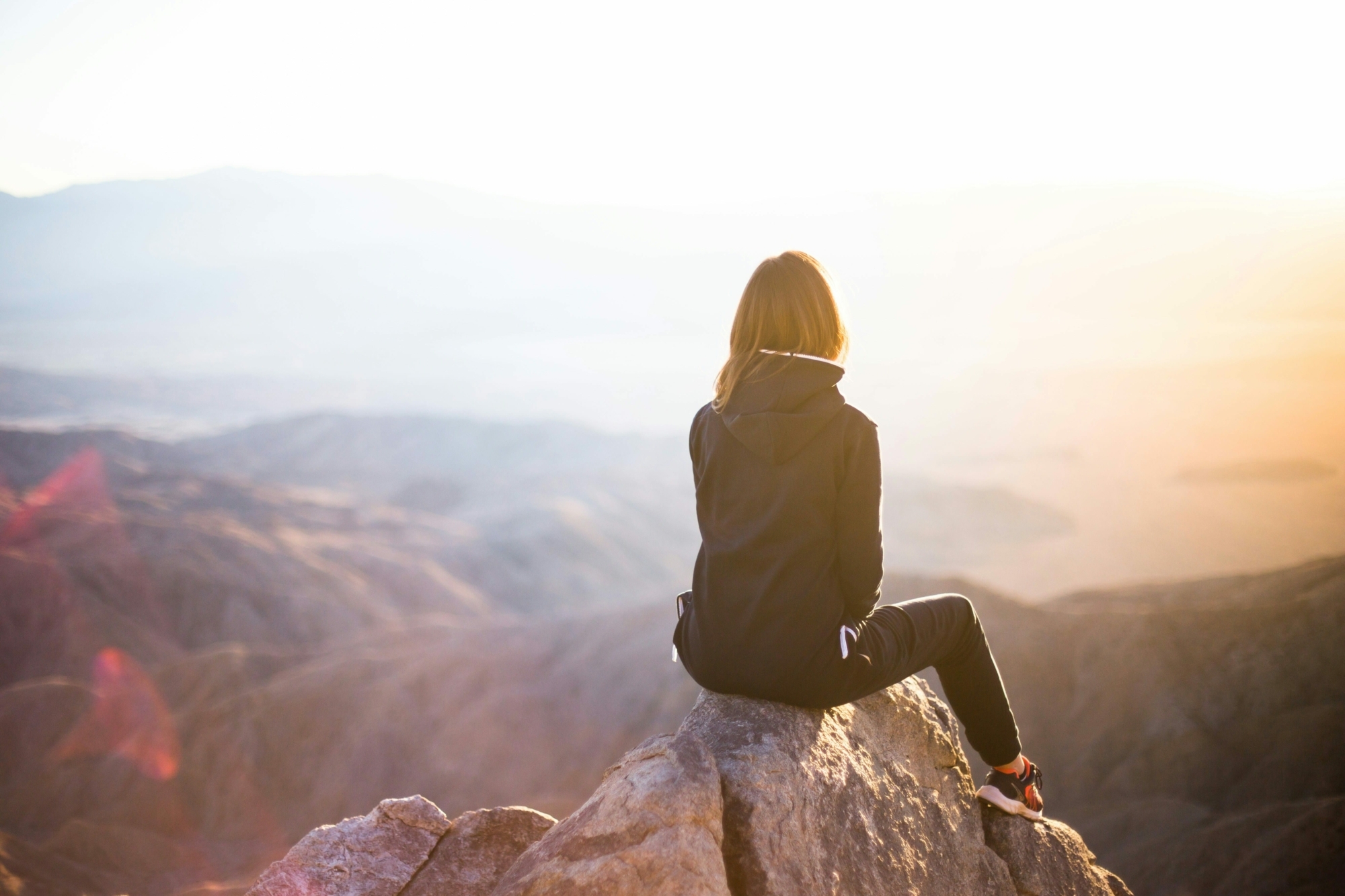 woman sat on a mountain
