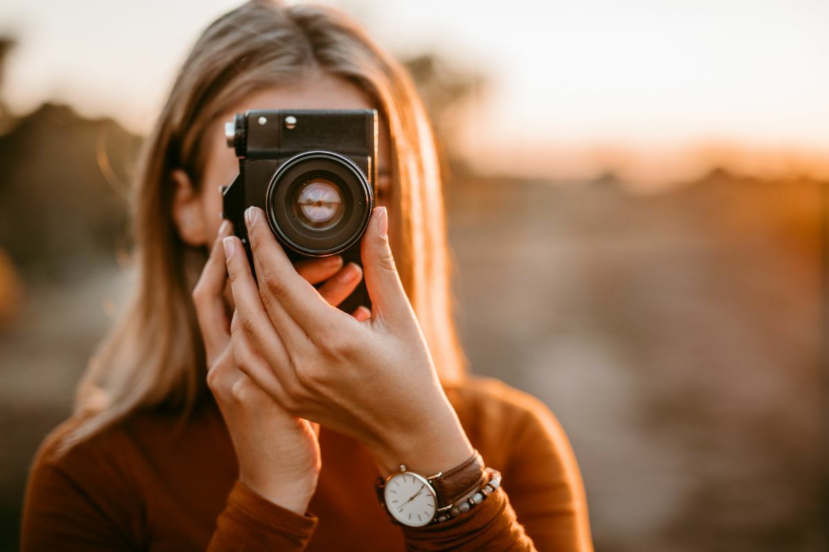 Lady taking a photo with a camera