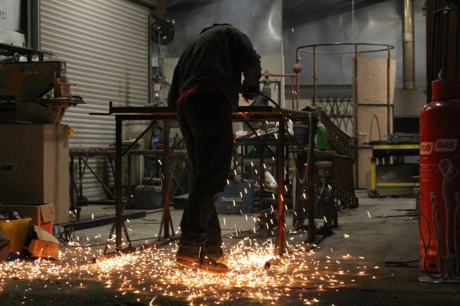 Man welding with sparks flying